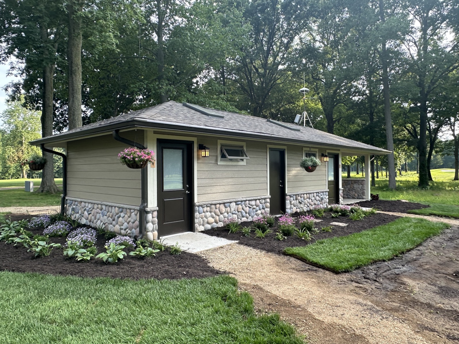 Completed building with stonework and landscaping
